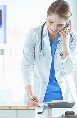 Image of a doctor checking on an infant