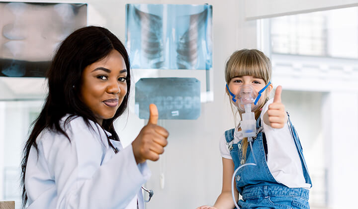 Image of trach patient smiling and outside