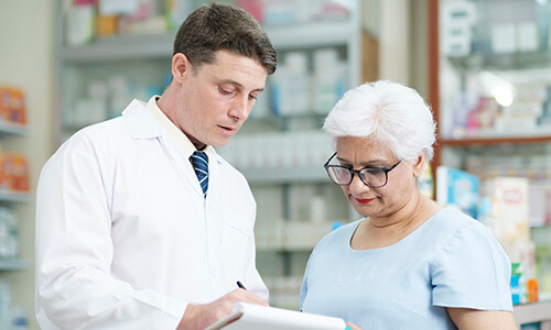 Pharmacists helping patient