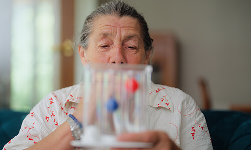 Woman with breathing apparatus